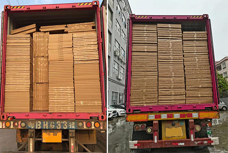 A stack of flat-packed cardboard displays ready for shipping