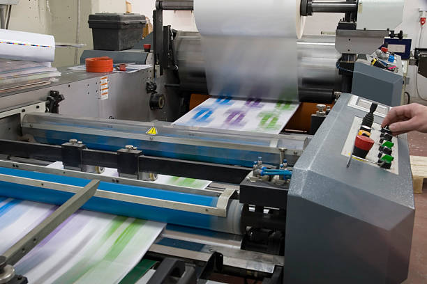 A digital printer applying ink directly onto a sheet of corrugated material for a sidekick display.