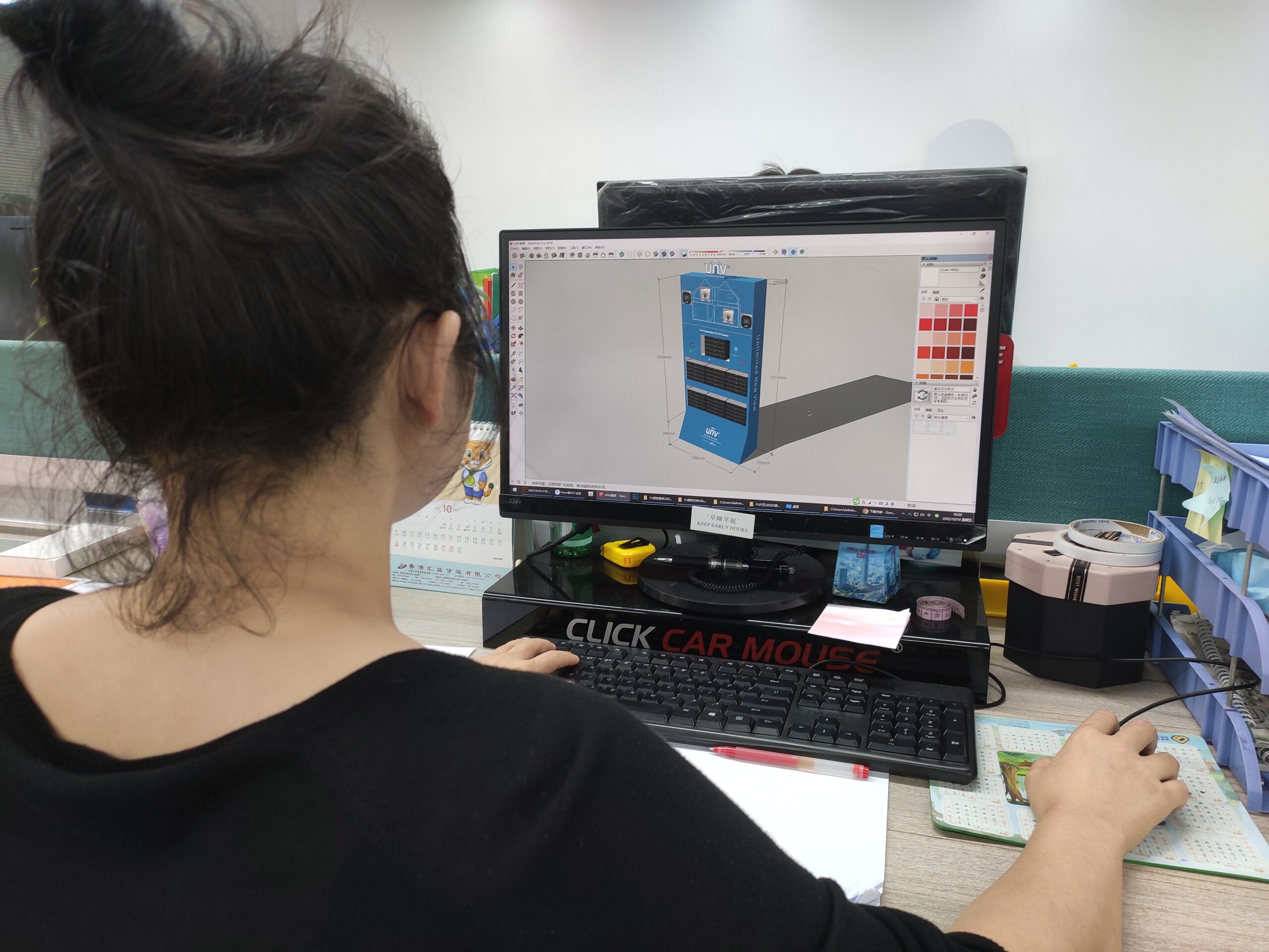 A designer sketching a POP display on a tablet