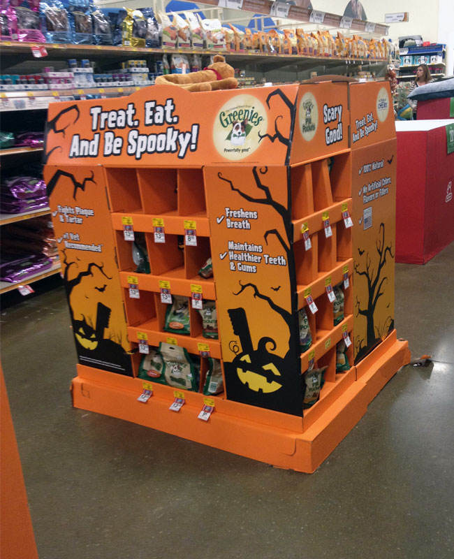 A collection of successful Costco PDQ displays in a warehouse aisle