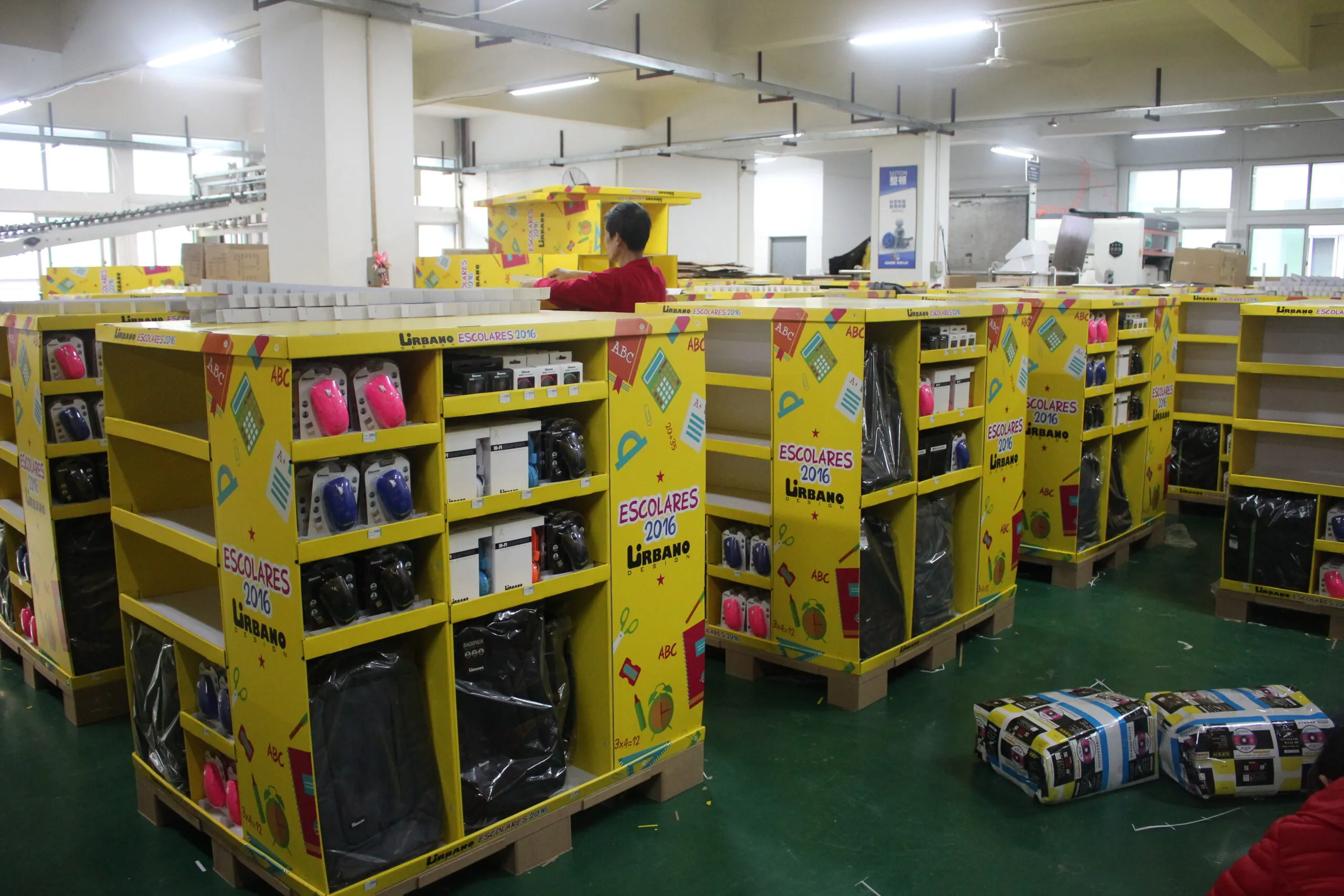A perfectly stacked and compliant Costco pallet display in a warehouse setting