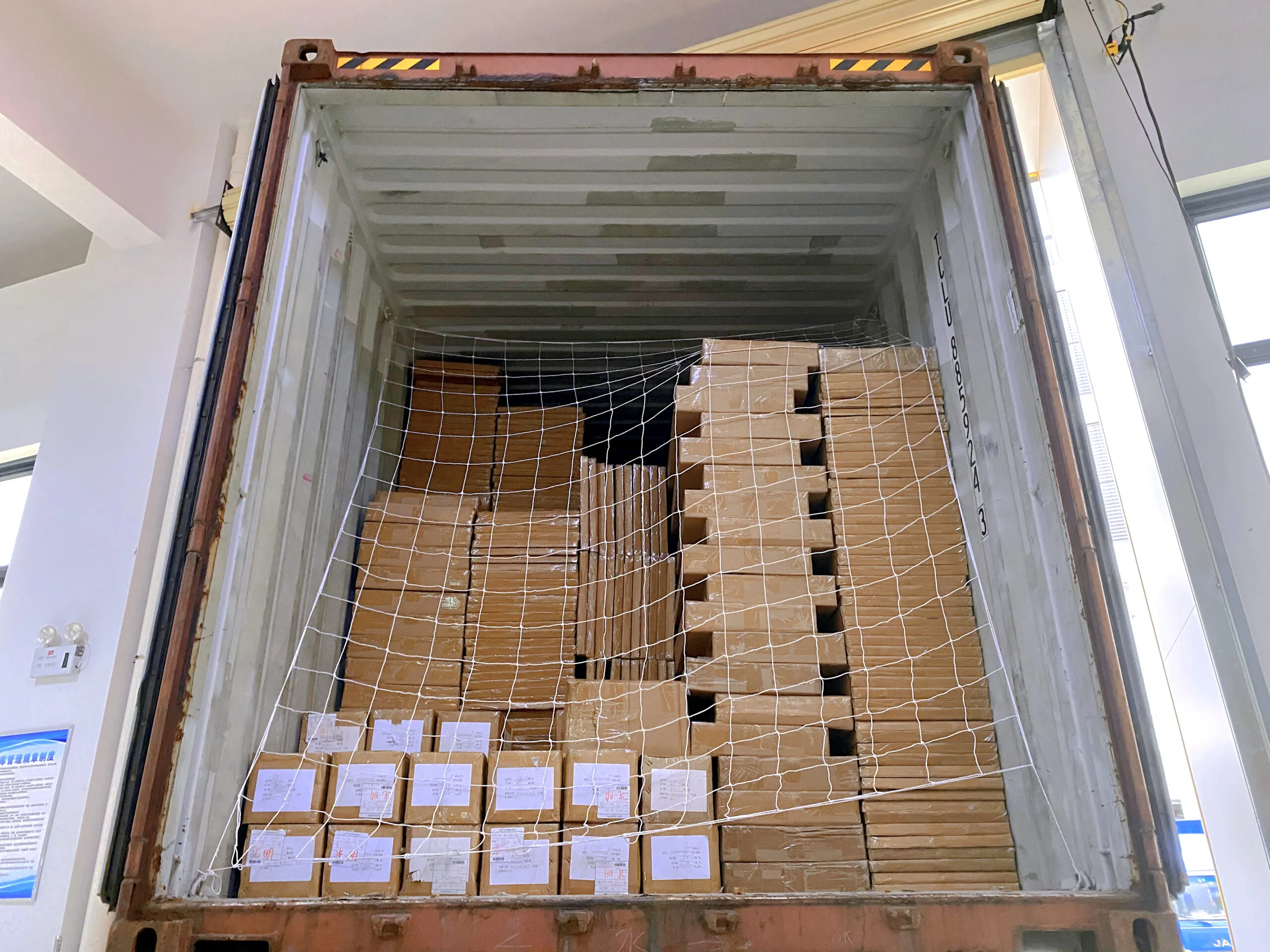 Packed cardboard display cartons prepared for shipment