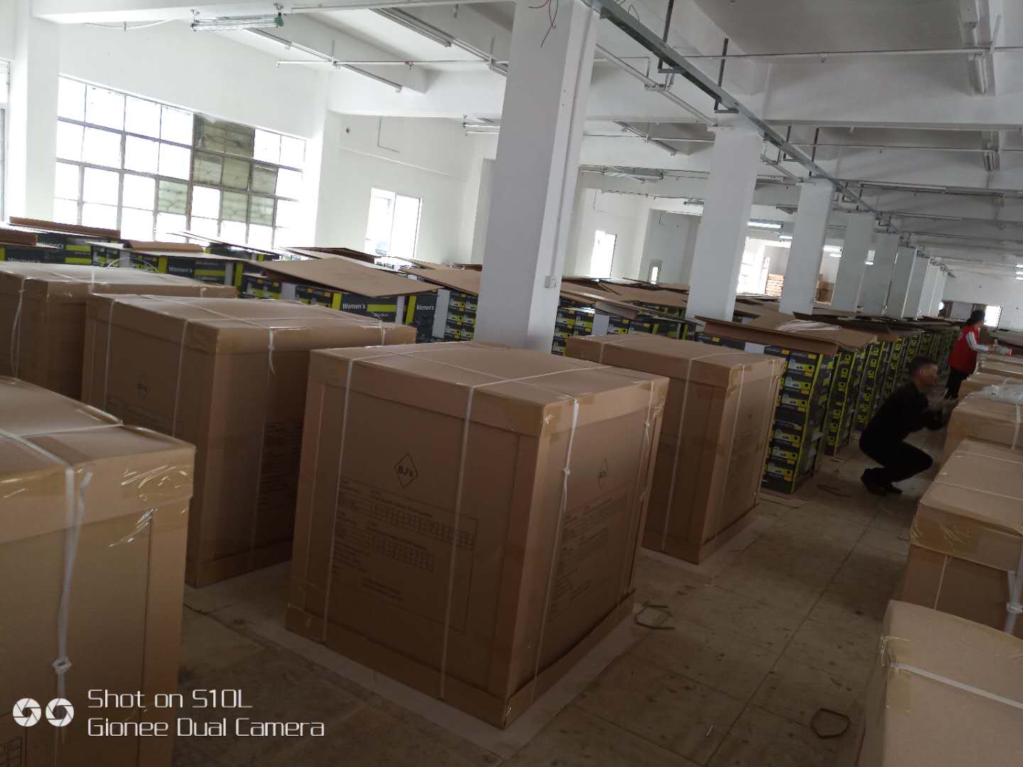 Neatly packed and waterproofed displays on a shipping pallet.