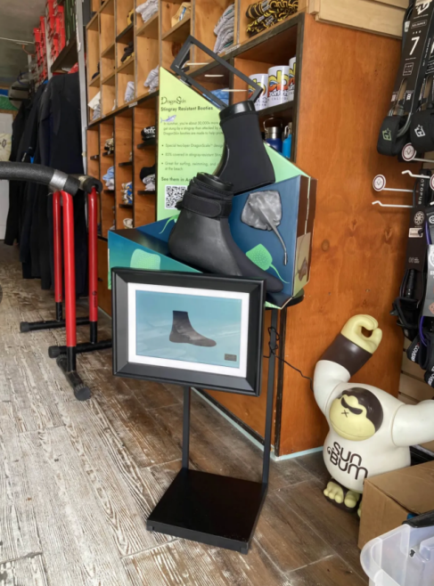 A retail employee easily places a PDQ display on a shelf.