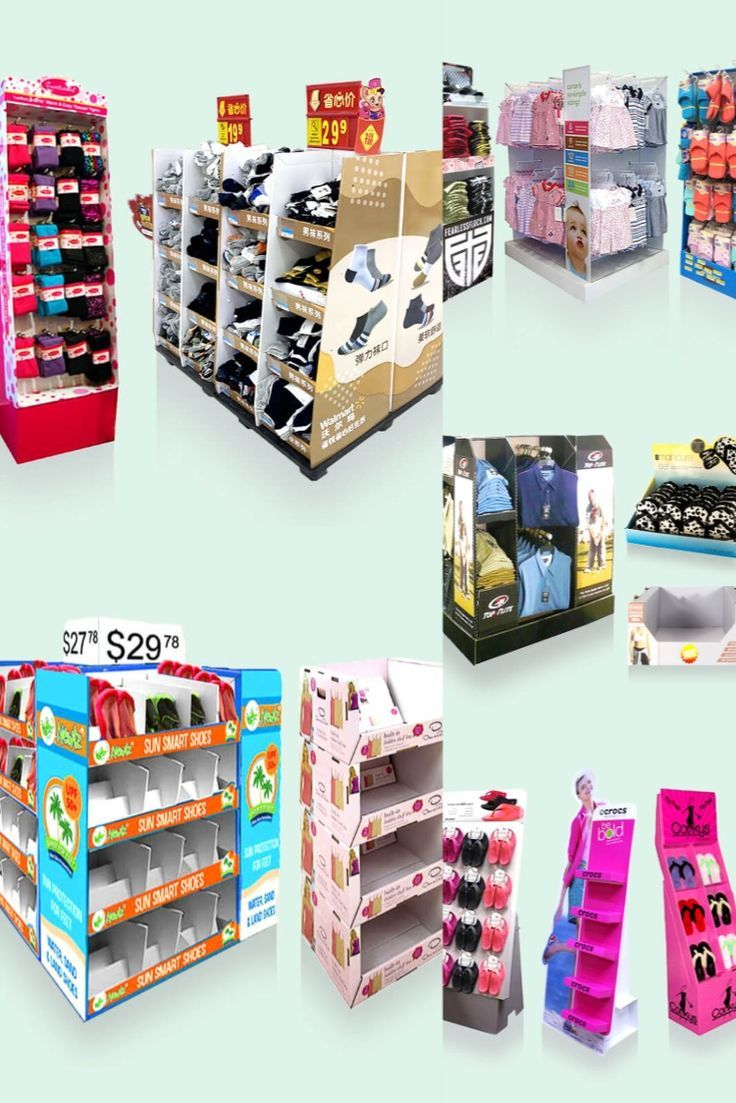 A variety of cardboard retail displays in a bright, clean warehouse.
