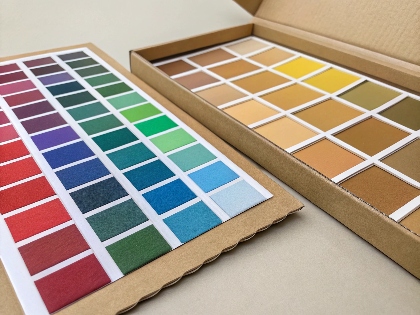 A color swatch perfectly matching a printed cardboard display.