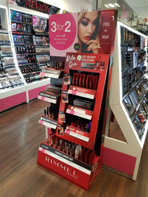 A large, impressive floor display for a major cosmetics brand, filled with hundreds of lipsticks