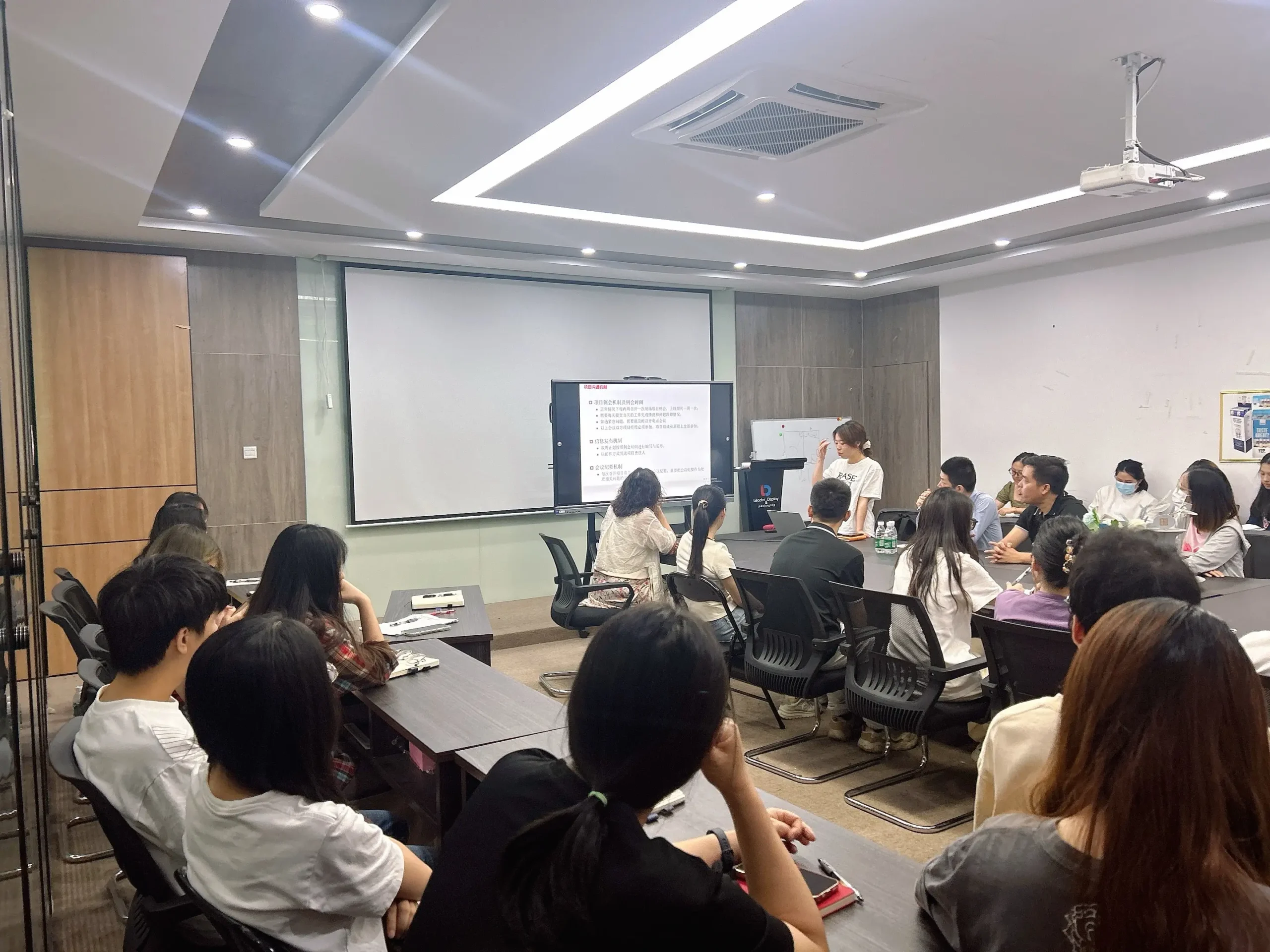 Lddisplay team collaborating over display sketches and prototypes in a design studio