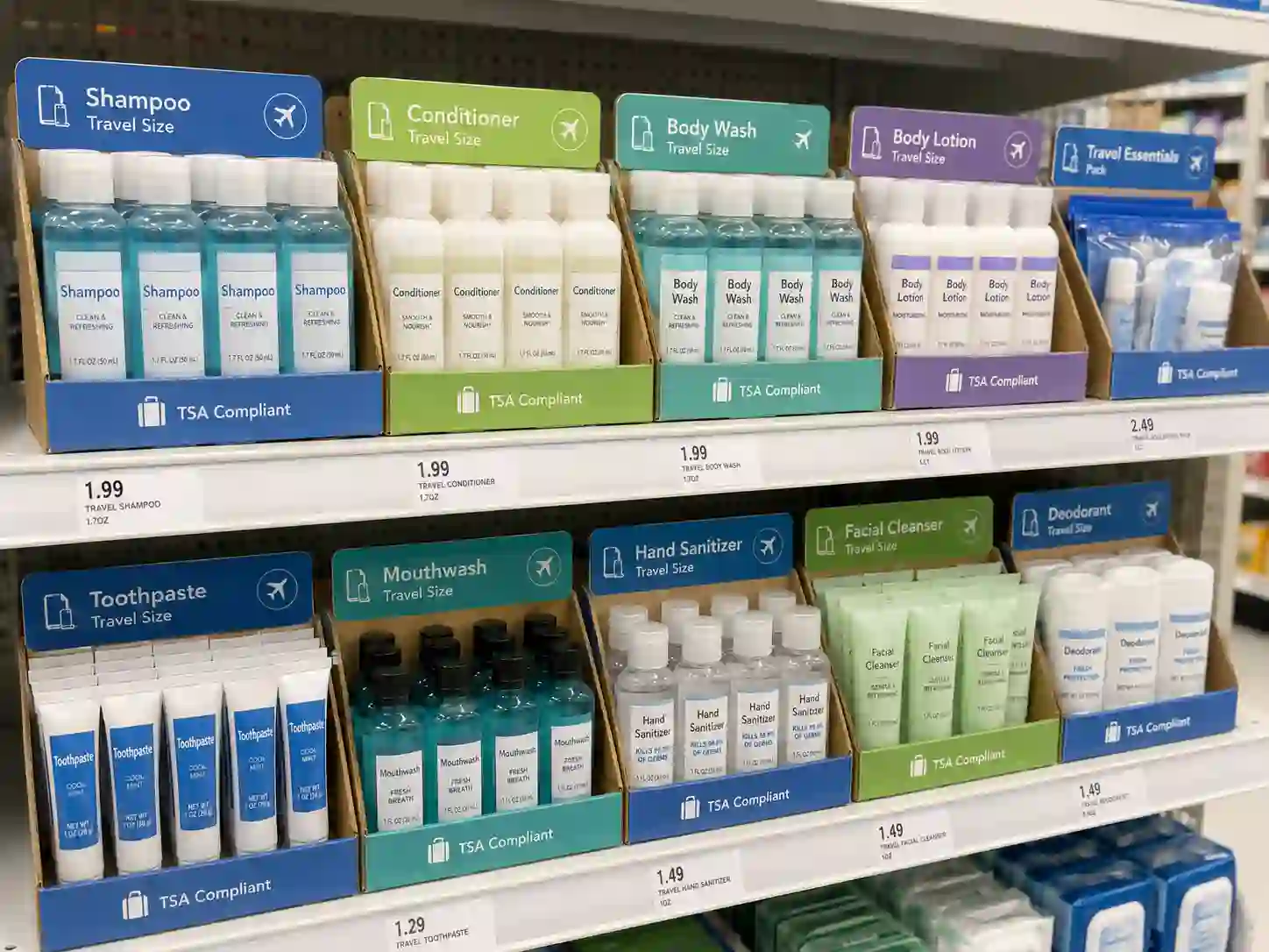 PDQ cardboard display for travel-size products on a retail shelf