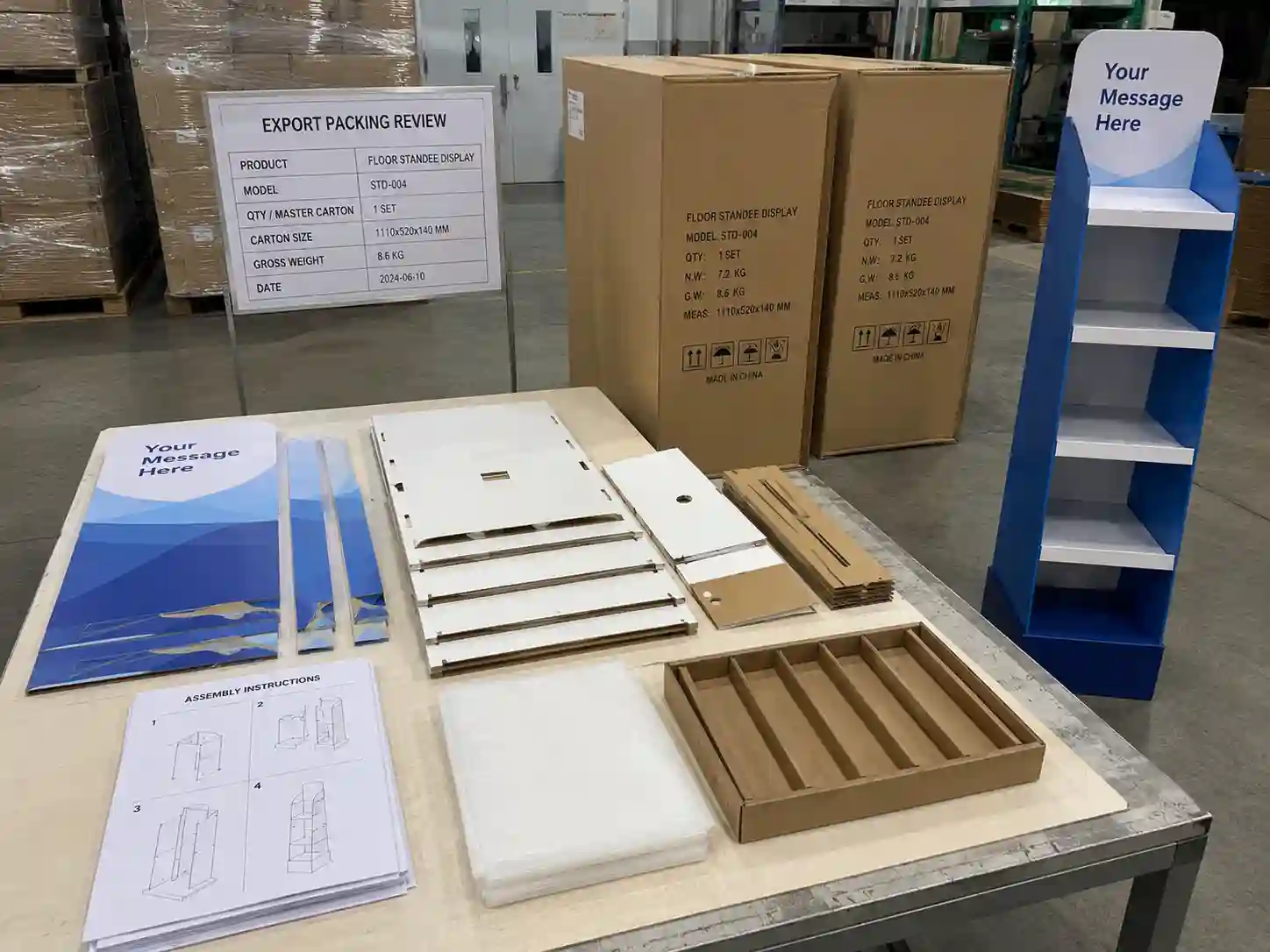 Flat-packed standee display components prepared for export packing with assembly instructions