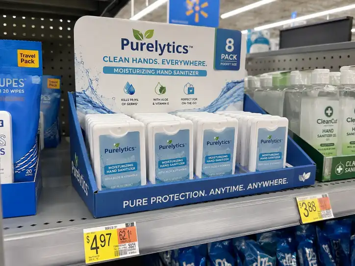 Walmart PDQ display tray on a retail shelf showing product arrangement with branded header and proper shelf-ready packaging format