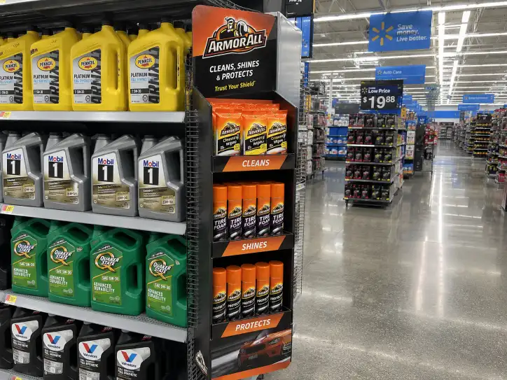 Walmart sidekick display hanging on a store shelf endcap showing product organized in a corrugated power wing attachment with branded header