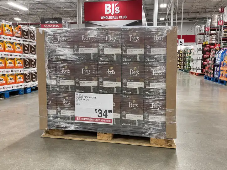 BJ's Wholesale Club aisle with a pre-filled pallet display on a GMA 48x40 pallet, shrink-wrapped and floor-ready.