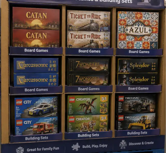Close-up of board games and building sets in individual compartments with snug fit