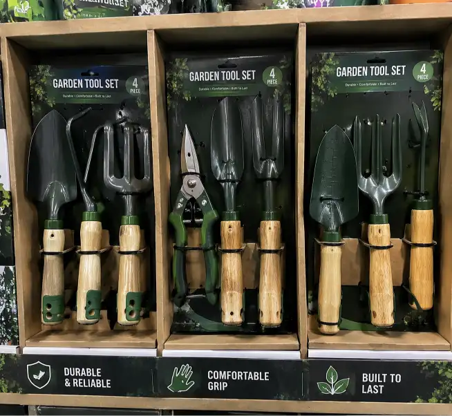 Close-up of gardening tool sets in individual compartments