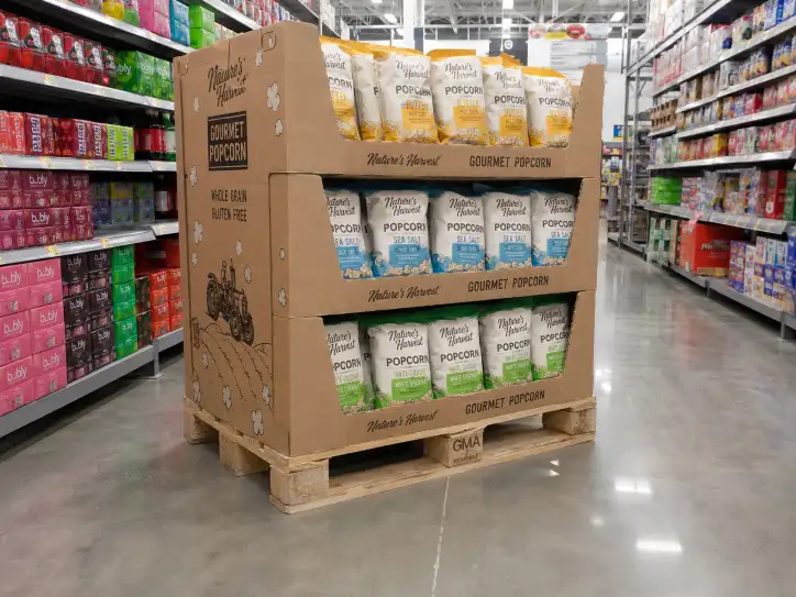 Corrugated pallet display loaded with product on a GMA pallet in a retail aisle.
