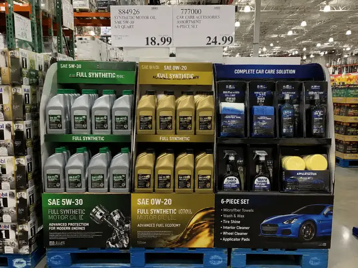 Costco pallet display for automotive products showing motor oil bottles and car care accessories in organized compartments