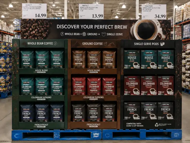 Costco pallet display for coffee showing whole bean bags, ground coffee, and single-serve pods in organized compartments