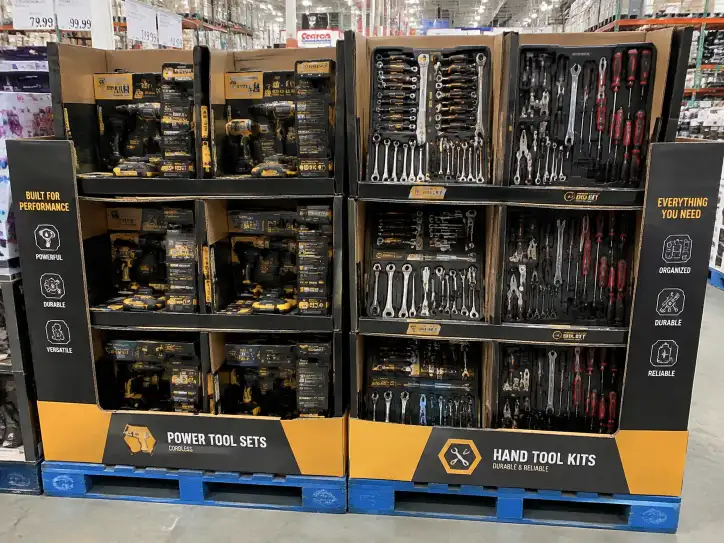 Costco pallet display for tools showing power tool sets and hand tool kits in reinforced corrugated compartments