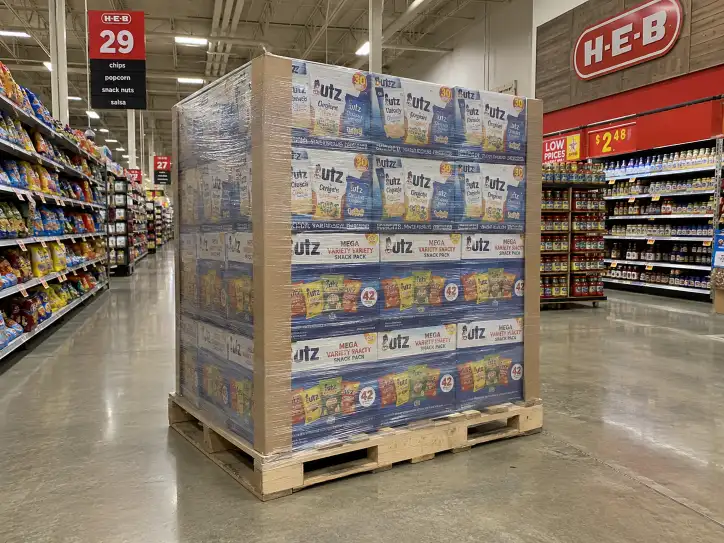 H-E-B supermarket aisle with a display-ready pallet display on a GMA 48x40 pallet, shrink-wrapped with corner boards.