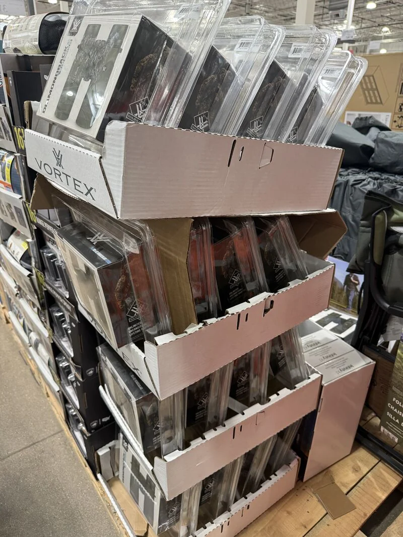 Corrugated PDQ display trays with distorted edges and exposed cardboard